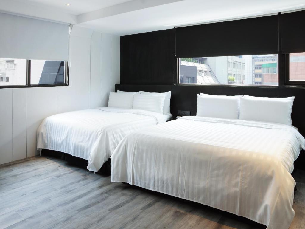 Voodi või voodid majutusasutuse Hotel Relax III toas
