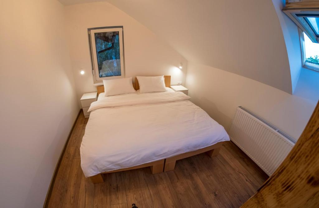 Postel nebo postele na pokoji v ubytování Petlov salaš rooms