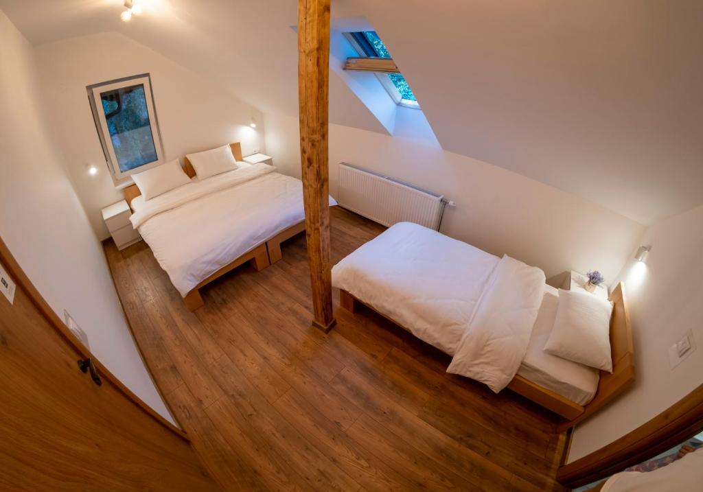 Postel nebo postele na pokoji v ubytování Petlov salaš rooms