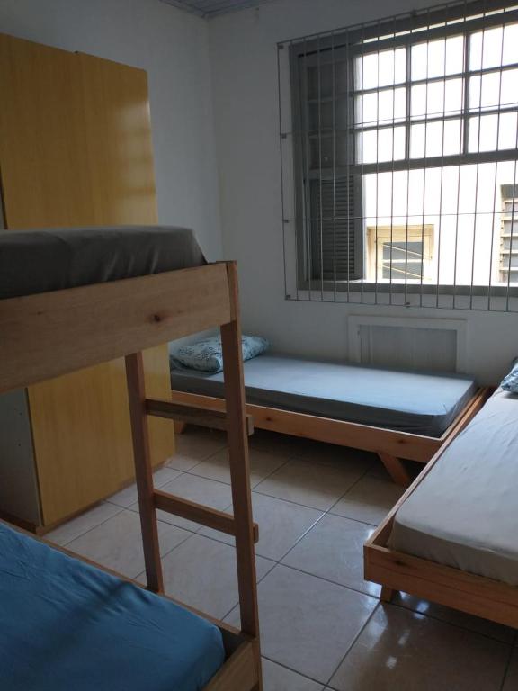 Postel nebo postele na pokoji v ubytování Hostel Cachoeira
