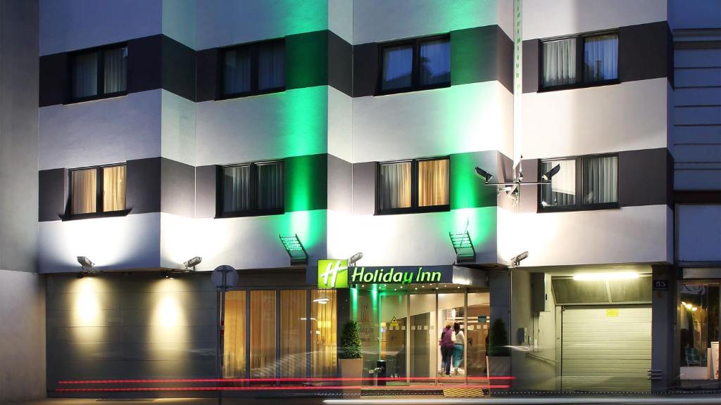a building with a hotel inn sign in front of it at Holiday Inn Vienna City, an IHG Hotel in Vienna