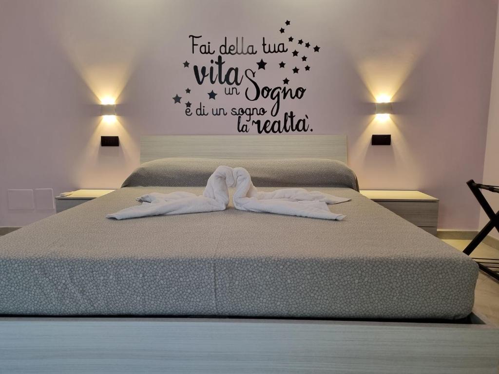Posteľ alebo postele v izbe v ubytovaní Il Piccolo Sogno di Roma