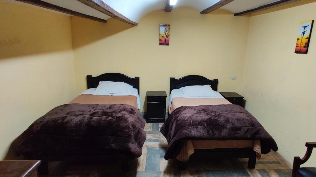 Postel nebo postele na pokoji v ubytování Wake Up Hostel
