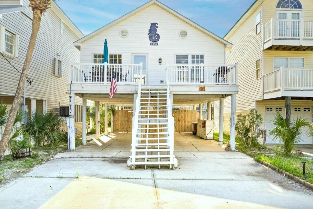 a house with a staircase in front of it at Willapye Beach House by the Sea in Navarre