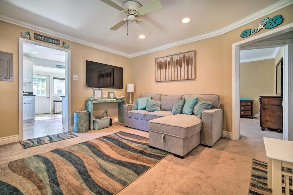 a living room with a couch and a table at Nautical Wildwood Apt - Walk to the Beach! in Wildwood