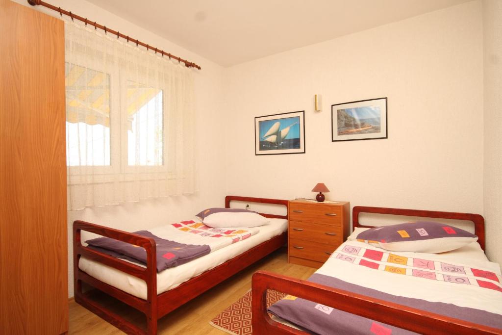 Fotografie z fotogalerie ubytování Apartments by the sea Cres - 7806 v destinaci Cres