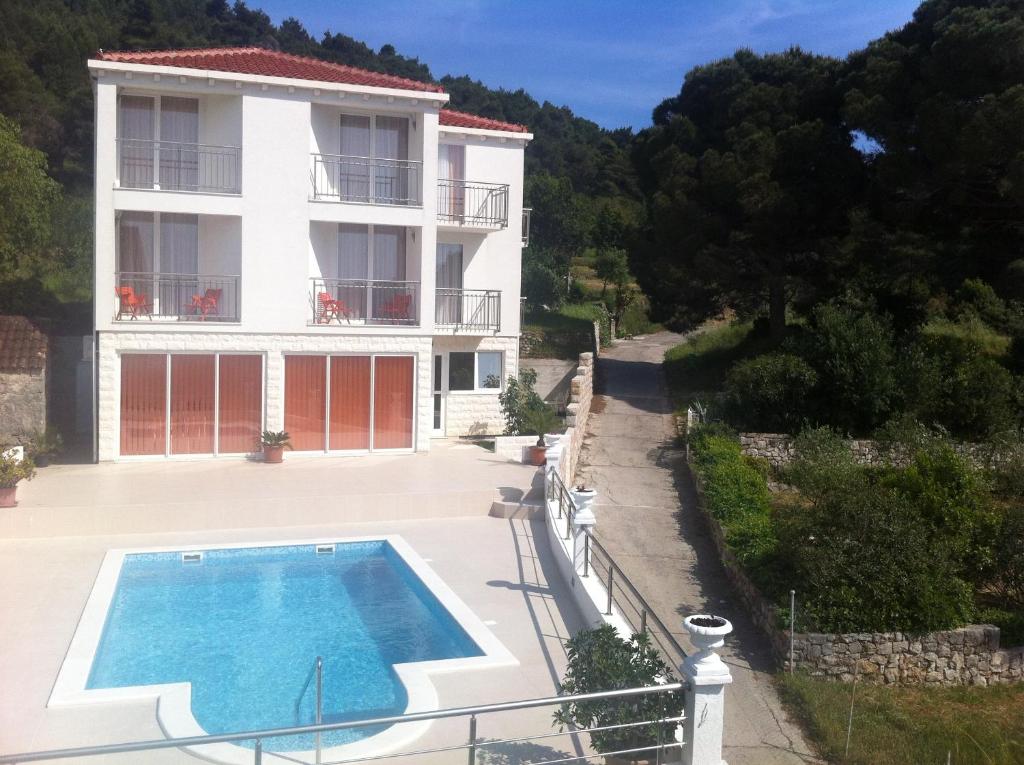 an image of a house with a swimming pool at White House Lopud,Dubrovnik in Lopud