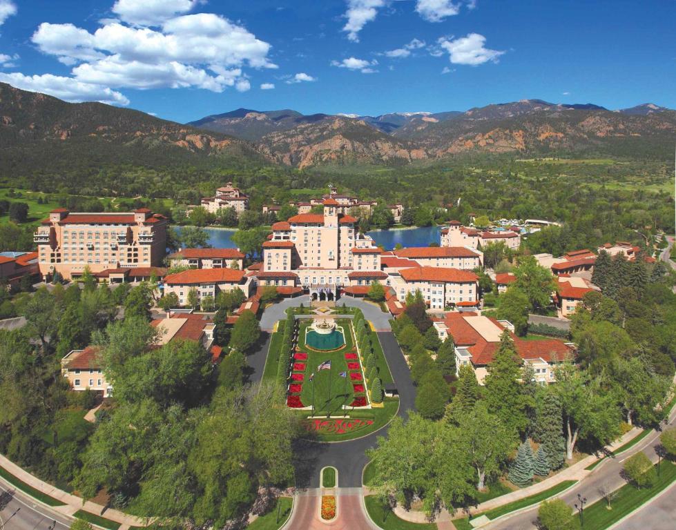 an aerial view of a city with buildings and trees at The Broadmoor in Colorado Springs