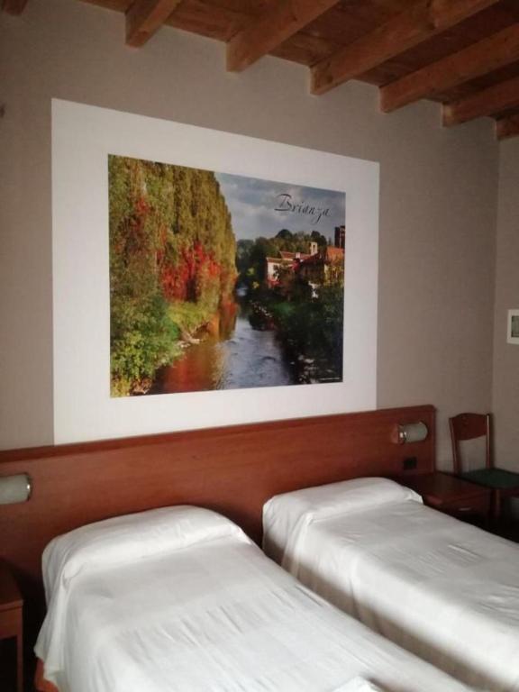 Postel nebo postele na pokoji v ubytování La Corte Albergo