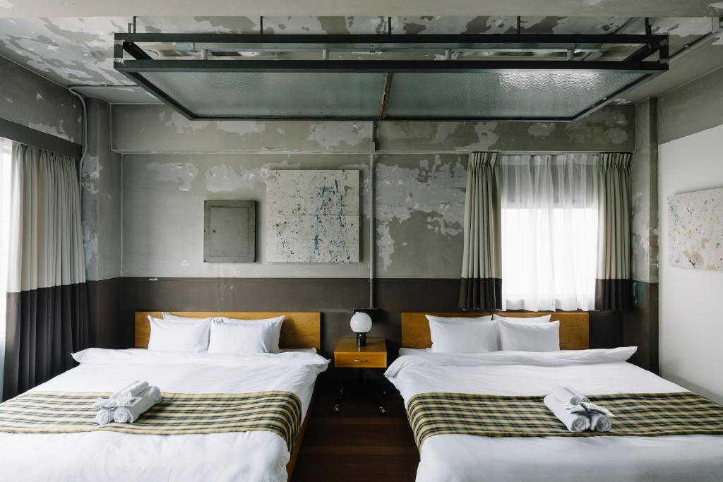 Postel nebo postele na pokoji v ubytování HOTEL Inc