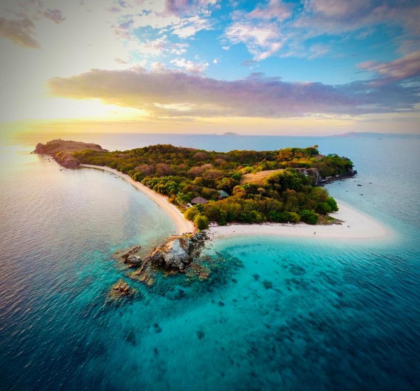 an aerial view of a small island in the ocean at Angel Island Eco Resort in Labuan Bajo