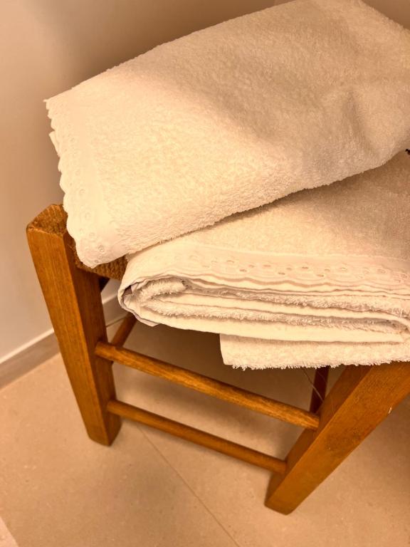 a close up of a stool with a towel on it at ADI BOUTIQUE HOUSE in Thessaloniki