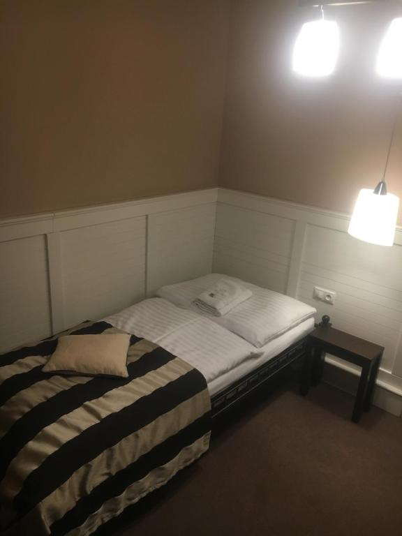 Ένα ή περισσότερα κρεβάτια σε δωμάτιο στο Pension Eden