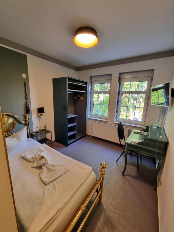 Postel nebo postele na pokoji v ubytování Haus Hennesburg, garni
