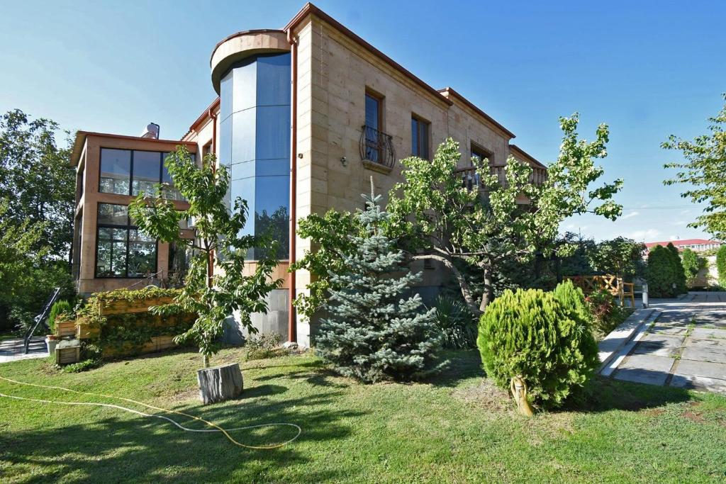 a house with a garden in front of it at Villa in Nork in Yerevan