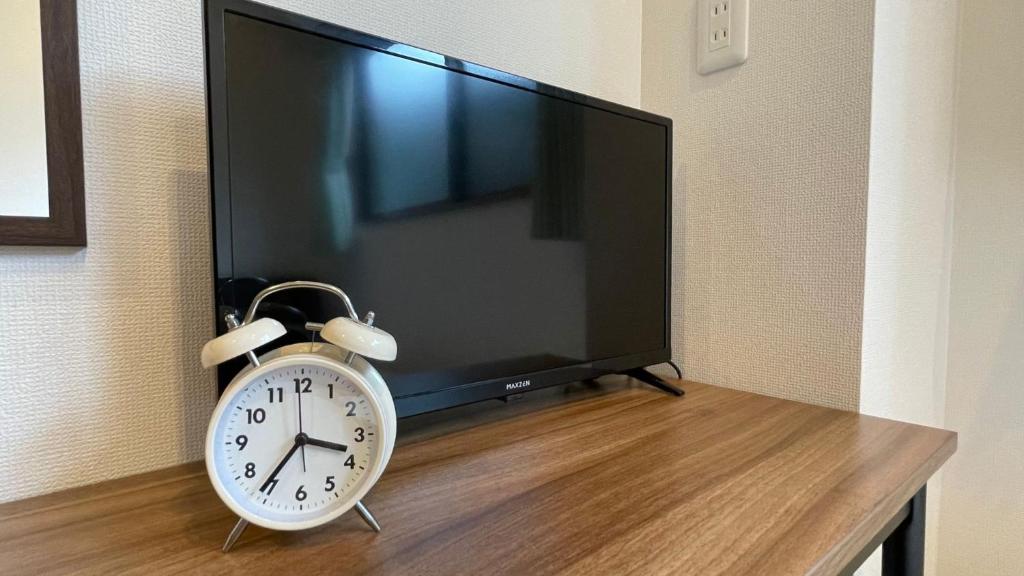 TV a/nebo společenská místnost v ubytování Hostel Inn Hashimoto