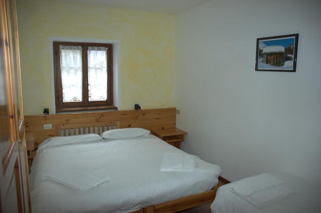 Postel nebo postele na pokoji v ubytování Casa Vacanze Ca' De Val