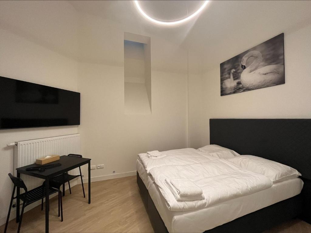Postel nebo postele na pokoji v ubytování Figaro Suites