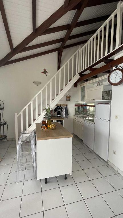 Kuchyň nebo kuchyňský kout v ubytování Appartement La Cannelle
