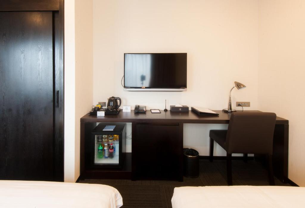 TV a/nebo společenská místnost v ubytování Sakura Hotel
