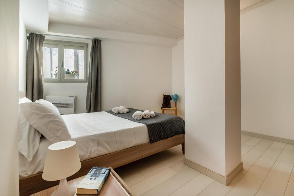 A bed or beds in a room at Fly Home Sicily