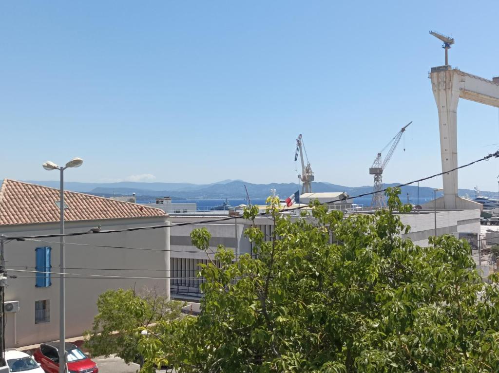 a view from the roof of a building with cranes at La Casa De La Ciotat in La Ciotat