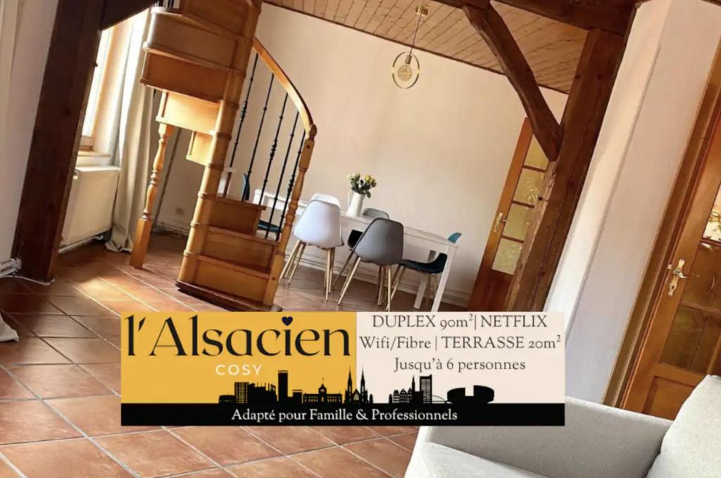 a room with a table and a dining room at L’Alsacien Cosy : Duplex - Netflix - Wifi/Fibre in Mulhouse