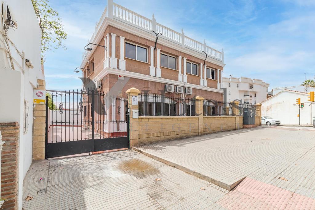 a building with a gate in front of it at AYZ Elcano - Auto check-in property in Málaga