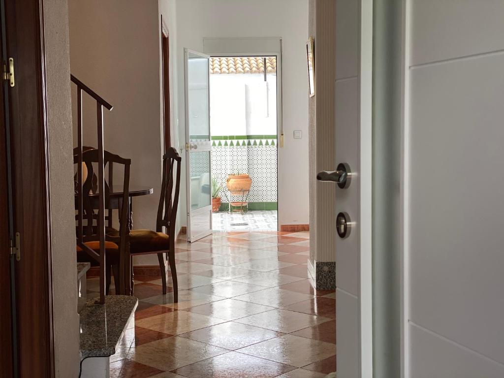 a hallway with a table and a dining room at Casa Medina in Algodonales