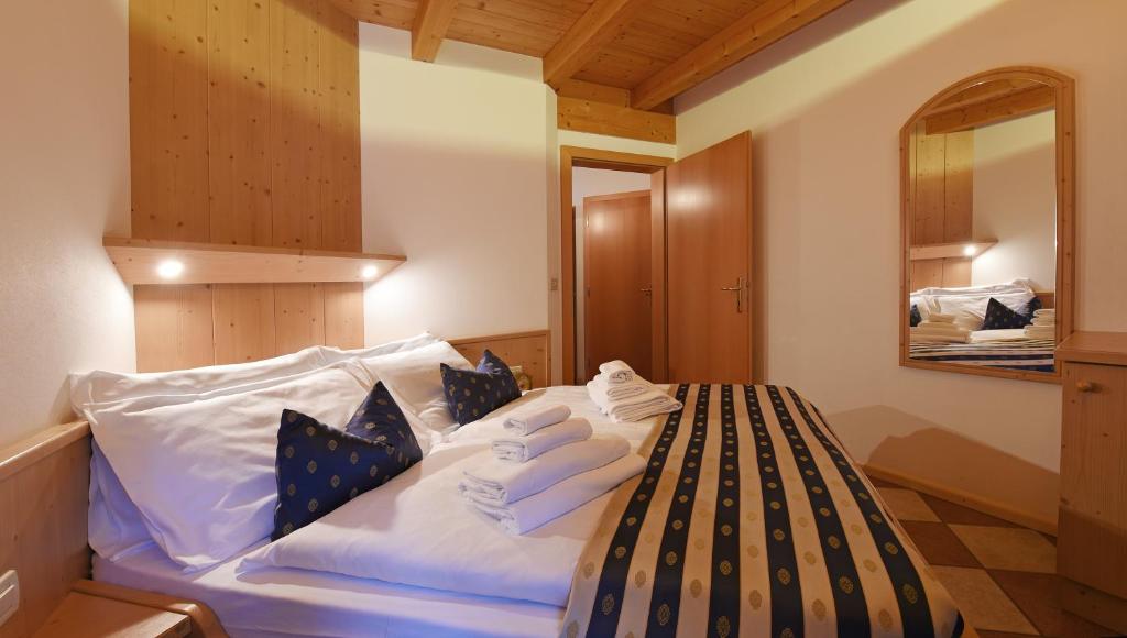 Postel nebo postele na pokoji v ubytování Alpin-Residence Amadeus