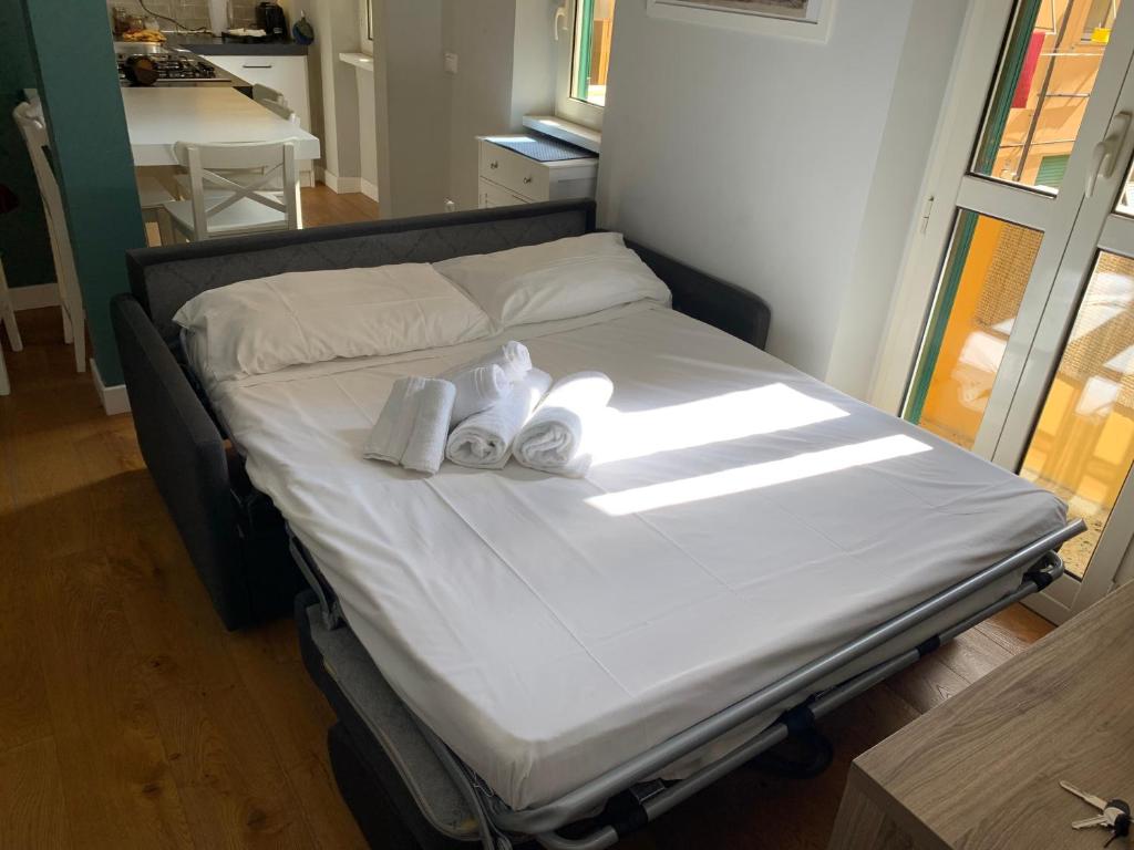 A bed or beds in a room at La Casetta del Flaminio a Roma Centro