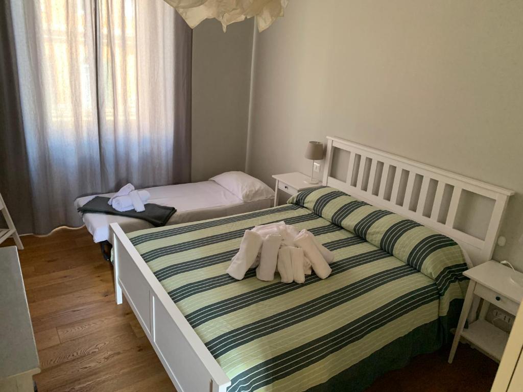 A bed or beds in a room at La Casetta del Flaminio a Roma Centro