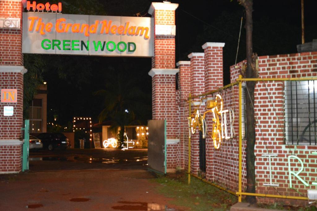 a sign that reads the grand mexican green wood at TGN SUITES - HOTEL in Raipur