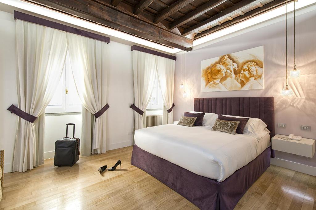 ローマにあるドムス リベラのベッドルーム1室(大型ベッド1台付)
