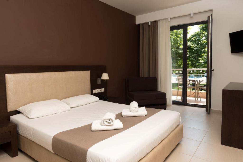 Postel nebo postele na pokoji v ubytování Hotel Giannoulis