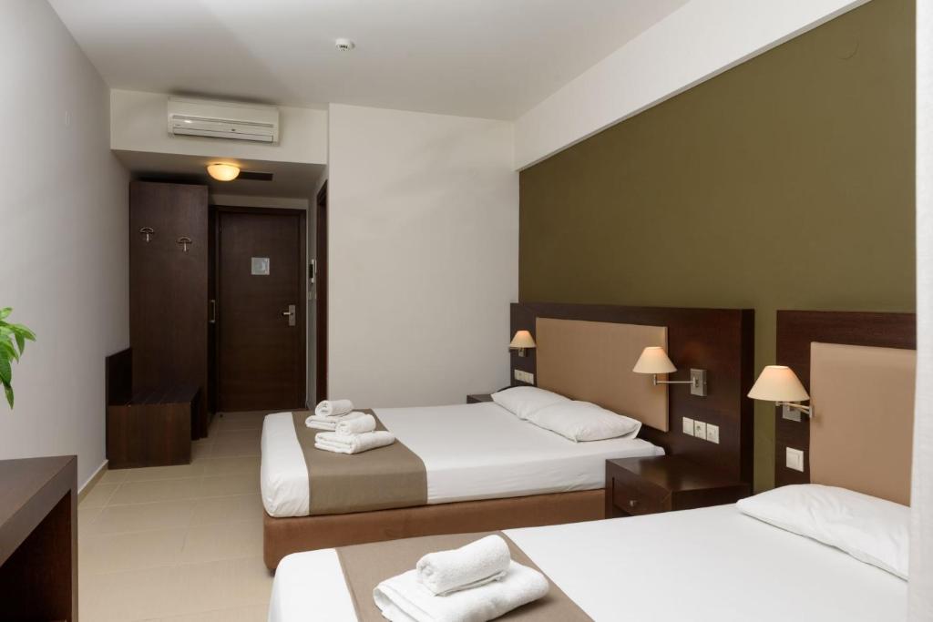 Postel nebo postele na pokoji v ubytování Hotel Giannoulis