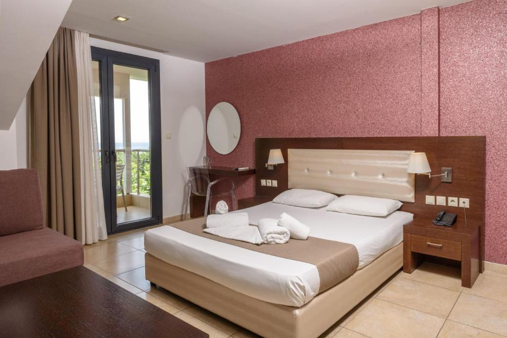 Postel nebo postele na pokoji v ubytování Hotel Giannoulis