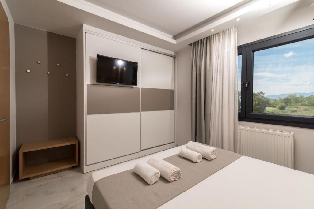 Postel nebo postele na pokoji v ubytování Hotel Giannoulis