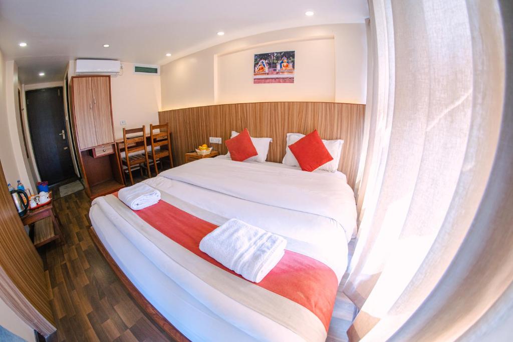Letto o letti in una camera di Hotel Chhimeki