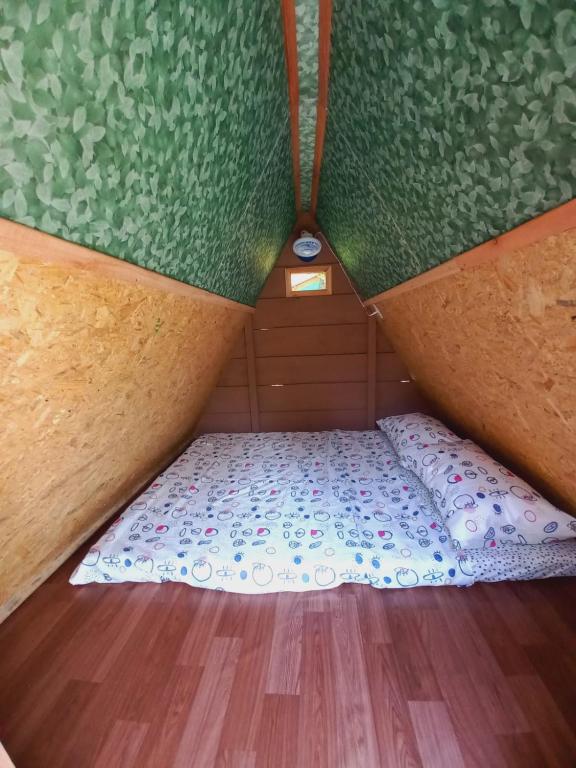 Postel nebo postele na pokoji v ubytování Piratas Cabanas Camping Bar