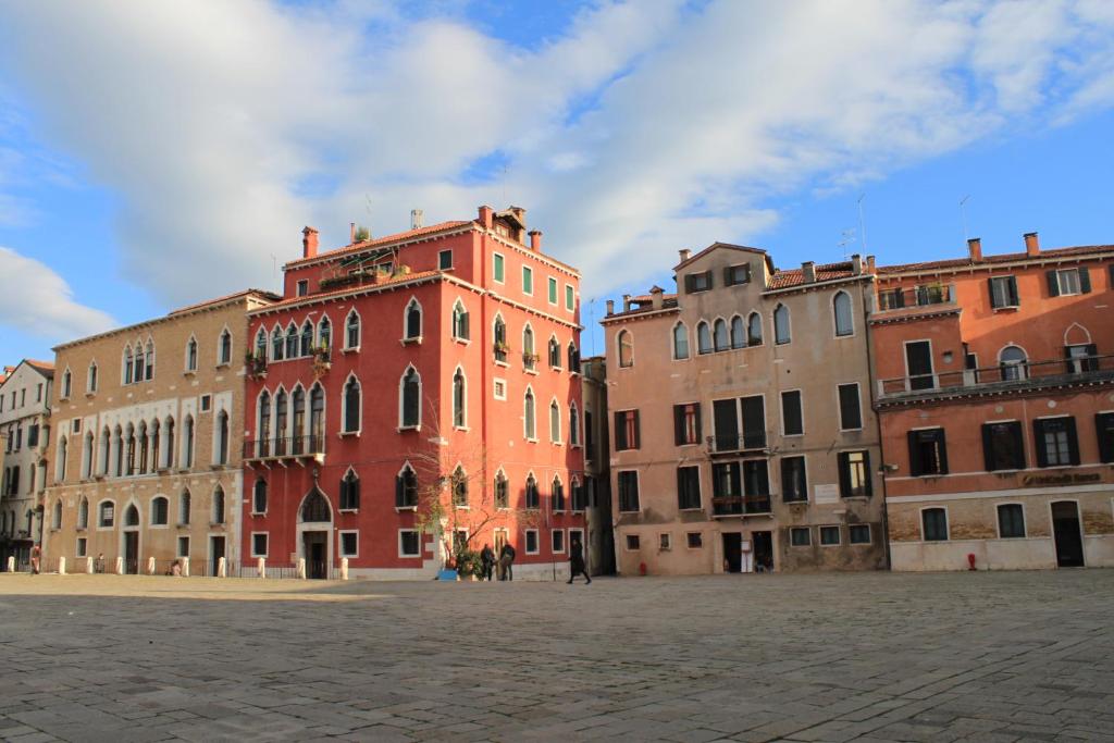 a group of buildings sitting next to each other at Sant'Angelo - Fenice Apartments in Venice in Venice