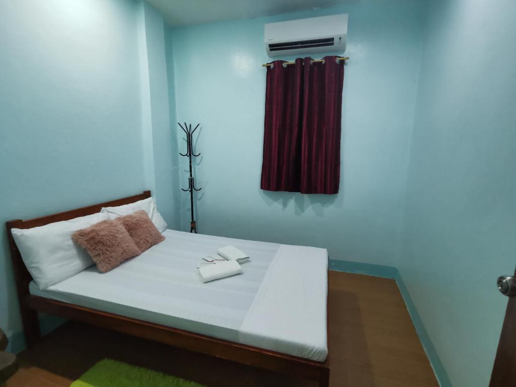 Postel nebo postele na pokoji v ubytování EZ & V Guesthouse
