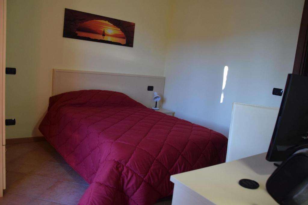 Łóżko lub łóżka w pokoju w obiekcie Hotel Il boschetto