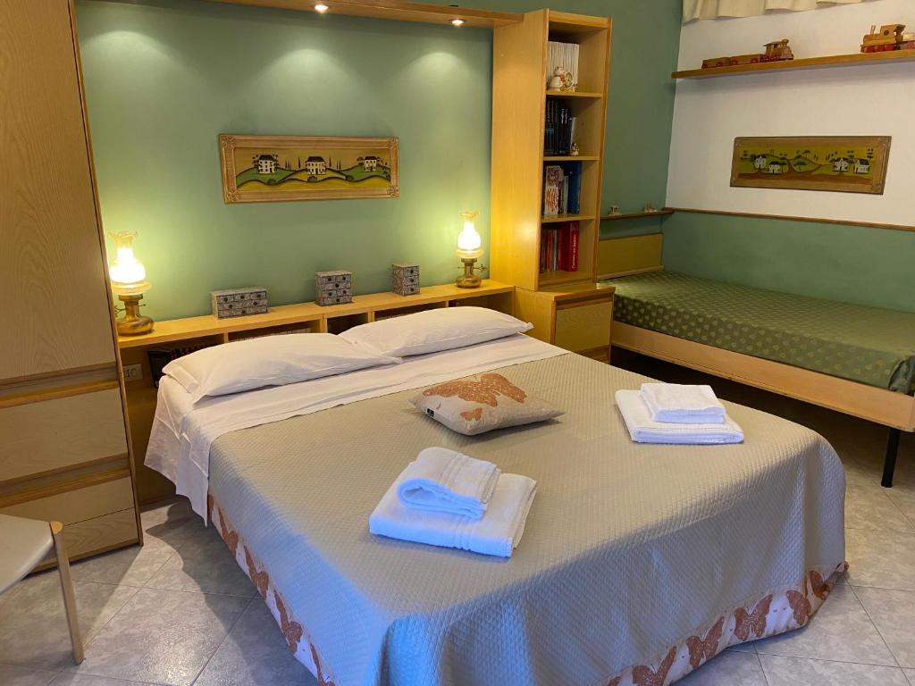 A bed or beds in a room at Residenza Antico Borgo del Pozzo