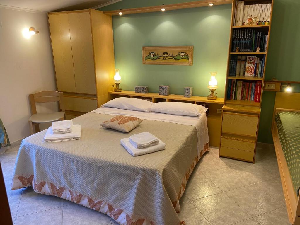 A bed or beds in a room at Residenza Antico Borgo del Pozzo