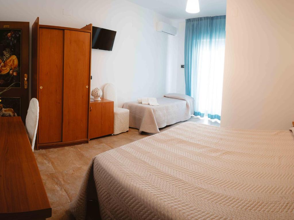 Postel nebo postele na pokoji v ubytování Accord Le Rose