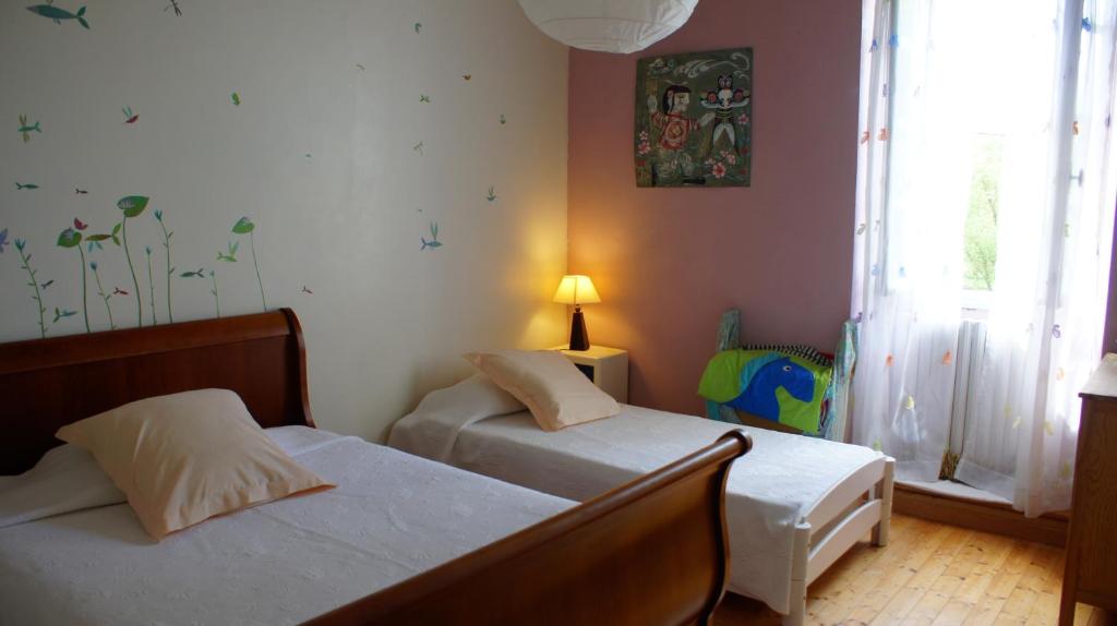 Postel nebo postele na pokoji v ubytování Chambres d'hôtes La Hourqueyre