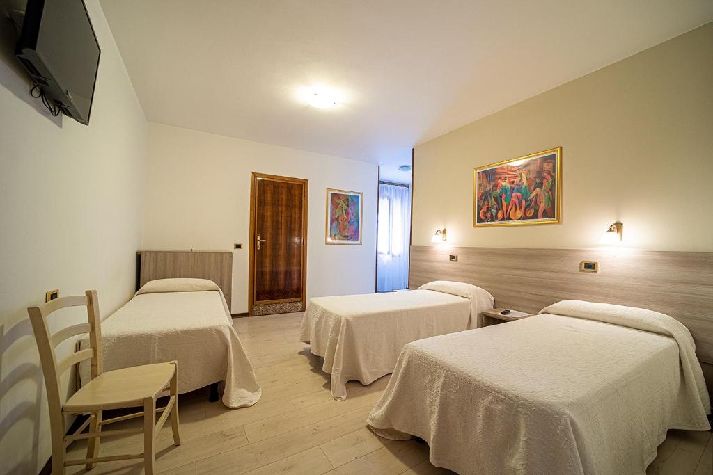Postel nebo postele na pokoji v ubytování Hotel da Romagnolo