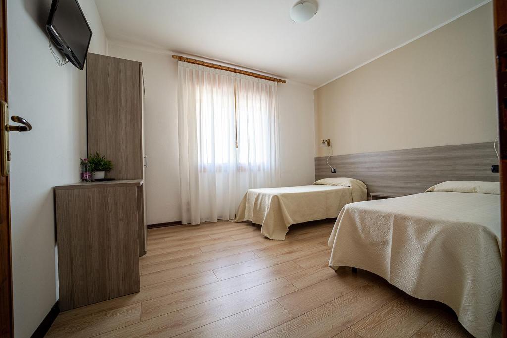 Postel nebo postele na pokoji v ubytování Hotel da Romagnolo