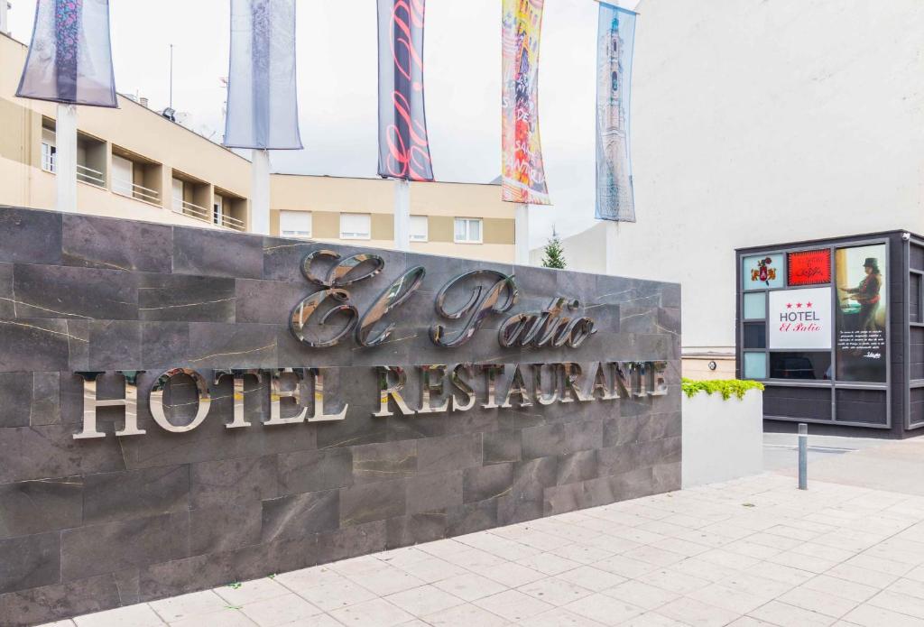 a hotel sign in front of a building at El Patio in La Almunia de Doña Godina